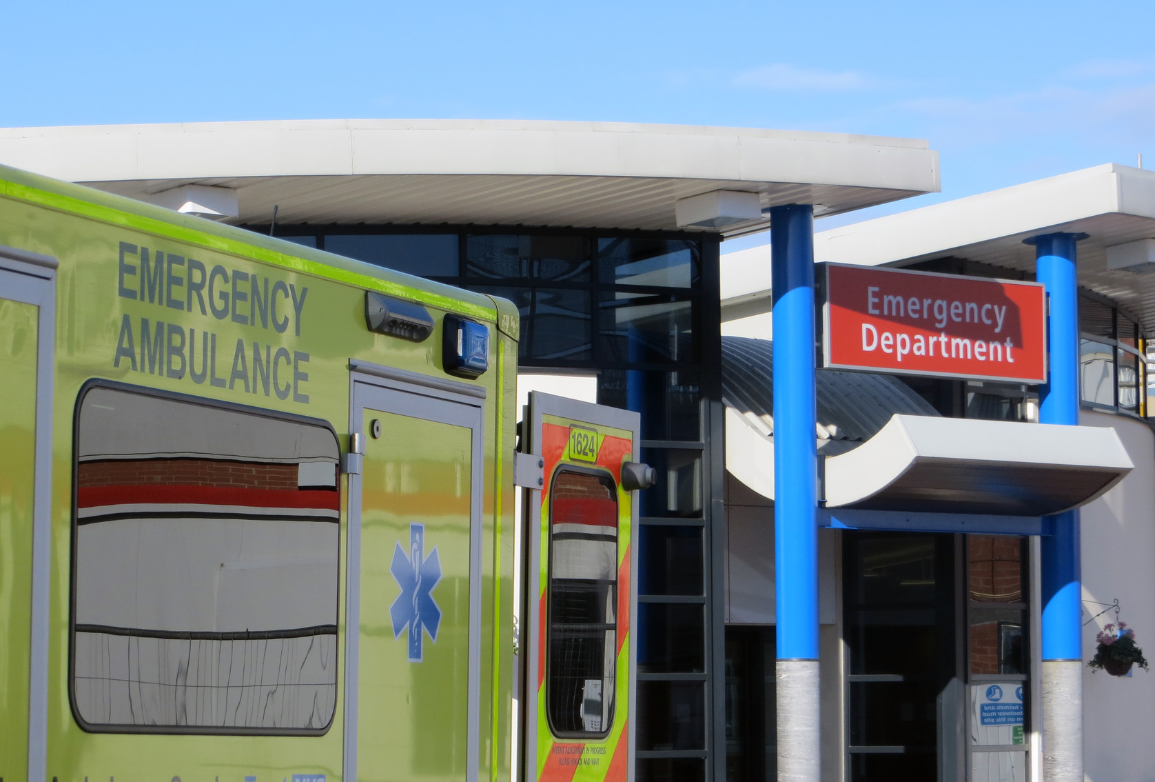 Ambulance vehicle parked outside of hospital emergency department